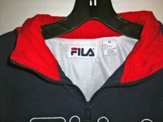 is a vintage FILA basketball style warm up jacket. 100% nylon zip up 