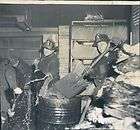 1961 chicago illinois firemen shovel water during city hall fire