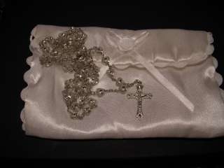 Rosary with clear plastic heart shaped beads and white satin bag 