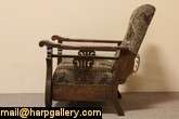   chair is solid quarter sawn oak with carved griffins and lyre motifs